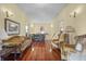 Sitting area with hardwood floors, antique furniture, and high ceilings at 927 Fishburne Rd, Pinopolis, SC 29469
