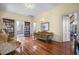 Sitting room with hardwood floors, built-in bookshelves, and antique furniture at 927 Fishburne Rd, Pinopolis, SC 29469