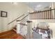 View of the grand staircase with wooden railings at 927 Fishburne Rd, Pinopolis, SC 29469
