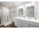 Bathroom with double vanity, shower and modern finishes at 9702 Roseberry St, Ladson, SC 29456