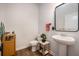 Modern bathroom with pedestal sink, toilet and decorative accents at 9702 Roseberry St, Ladson, SC 29456
