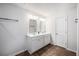 Double vanity bathroom with white cabinets and elegant lighting at 9702 Roseberry St, Ladson, SC 29456
