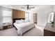 Spacious bedroom with a king-size bed and wood accent wall at 9702 Roseberry St, Ladson, SC 29456