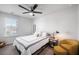 Charming bedroom with a queen-size bed and yellow armchair at 9702 Roseberry St, Ladson, SC 29456