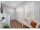 Bright entryway with wood floors, bench, and coat rack at 9702 Roseberry St, Ladson, SC 29456