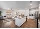 Modern kitchen with white cabinets, granite island, and stainless steel appliances at 9702 Roseberry St, Ladson, SC 29456