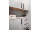Laundry room with white cabinets and drawers, wooden countertop at 9702 Roseberry St, Ladson, SC 29456