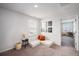 Upstairs ' loft with seating area and access to bedroom at 9702 Roseberry St, Ladson, SC 29456
