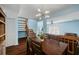 Bright dining area with a dark wood table and access to the living room at 1101 Reserve Way, Summerville, SC 29485