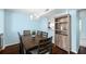 Spacious dining room with wood table and built-in shelving at 1101 Reserve Way, Summerville, SC 29485