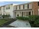Two-story townhome with a covered porch and well-maintained landscaping at 1101 Reserve Way, Summerville, SC 29485