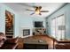 Living room boasts hardwood floors, a fireplace, and ample natural light at 1101 Reserve Way, Summerville, SC 29485