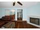 Open living room with hardwood floors and a view into the dining area at 1101 Reserve Way, Summerville, SC 29485