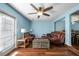 Spacious living room featuring hardwood floors and comfortable leather furniture at 1101 Reserve Way, Summerville, SC 29485