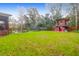 Large backyard with a playset, trampoline, and fire pit at 1159 Wyndham Rd, Charleston, SC 29412