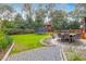 Large backyard with patio, firepit, playset, and trampoline at 1159 Wyndham Rd, Charleston, SC 29412