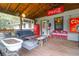 Covered patio features vintage decor and comfortable seating at 1159 Wyndham Rd, Charleston, SC 29412