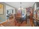 Bright dining area with a rustic table and vintage artwork at 1159 Wyndham Rd, Charleston, SC 29412