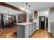 Island kitchen features hardwood floors, modern cabinetry, and a dining area at 1159 Wyndham Rd, Charleston, SC 29412