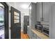 Functional laundry room with gray cabinets and modern appliances at 1159 Wyndham Rd, Charleston, SC 29412