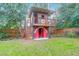 Unique playhouse designed as a fire station in the backyard at 1159 Wyndham Rd, Charleston, SC 29412