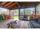 Relaxing screened porch with wooden flooring and comfortable seating at 1159 Wyndham Rd, Charleston, SC 29412