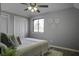 Bright bedroom with a queen bed and neutral decor at 117 Hummingbird Ave, Ladson, SC 29456