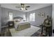 Cozy bedroom with a wicker headboard and neutral color scheme at 117 Hummingbird Ave, Ladson, SC 29456