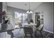 Charming dining area with a round table and sliding glass door at 117 Hummingbird Ave, Ladson, SC 29456