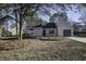 Newly renovated gray house with a landscaped yard and driveway at 117 Hummingbird Ave, Ladson, SC 29456
