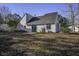 Rear view of a single-Gathering home with gray siding at 117 Hummingbird Ave, Ladson, SC 29456