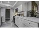 Modern kitchen with white cabinets, quartz countertops, and stainless steel appliances at 117 Hummingbird Ave, Ladson, SC 29456