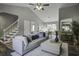 Open concept living area with hardwood floors and a sectional couch at 117 Hummingbird Ave, Ladson, SC 29456