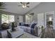 Light and airy living room with a large window and sectional at 117 Hummingbird Ave, Ladson, SC 29456