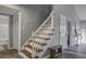 Wooden staircase with white railings at 117 Hummingbird Ave, Ladson, SC 29456
