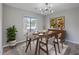 Dining room with wood table and mid-century modern decor at 1202 Waterwood Dr, Goose Creek, SC 29445