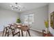 Bright dining room with wood table and window view at 1202 Waterwood Dr, Goose Creek, SC 29445