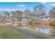 Community view showcasing waterfront homes and landscaping at 1202 Waterwood Dr, Goose Creek, SC 29445