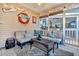 Relaxing screened porch with seating and string lights at 1260 Chatfield St, Mount Pleasant, SC 29464