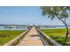 Wooden dock extending to a waterfront building at 130 River Landing Dr # 7116, Charleston, SC 29492