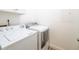 Laundry room with white washer and dryer at 130 River Landing Dr # 7116, Charleston, SC 29492