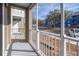 Screened porch with white railing and view of community at 130 River Landing Dr # 7116, Charleston, SC 29492