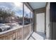 Screened porch with white door and view of community at 130 River Landing Dr # 7116, Charleston, SC 29492