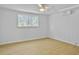 Spacious bedroom with hardwood floors and a large window at 138 Green Pond Hwy, Walterboro, SC 29488