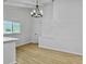 Bright dining room features hardwood floors, chandelier, and large window at 138 Green Pond Hwy, Walterboro, SC 29488