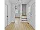 Light-filled entryway with hardwood floors and staircase at 138 Green Pond Hwy, Walterboro, SC 29488