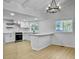 Open concept kitchen with white cabinets and a large island at 138 Green Pond Hwy, Walterboro, SC 29488