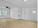 Living room with hardwood floors, ceiling fan, and white walls at 138 Green Pond Hwy, Walterboro, SC 29488