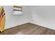 Empty bedroom with hardwood floors and surfboard at 1401 Westmoreland Ave, Charleston, SC 29412