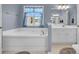 Relaxing bathroom with a large soaking tub and neutral color scheme at 145 Dasharon Ln, Goose Creek, SC 29445